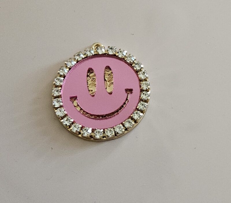 SMILEY PINK GOLD PLATED MET ACRYL EN STRAS BEDEL 3 CM